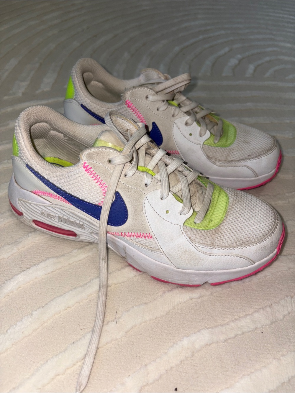 Nike AirMax White Athletic Shoes with Blue Swoosh and Neon Pink & Lime Accents